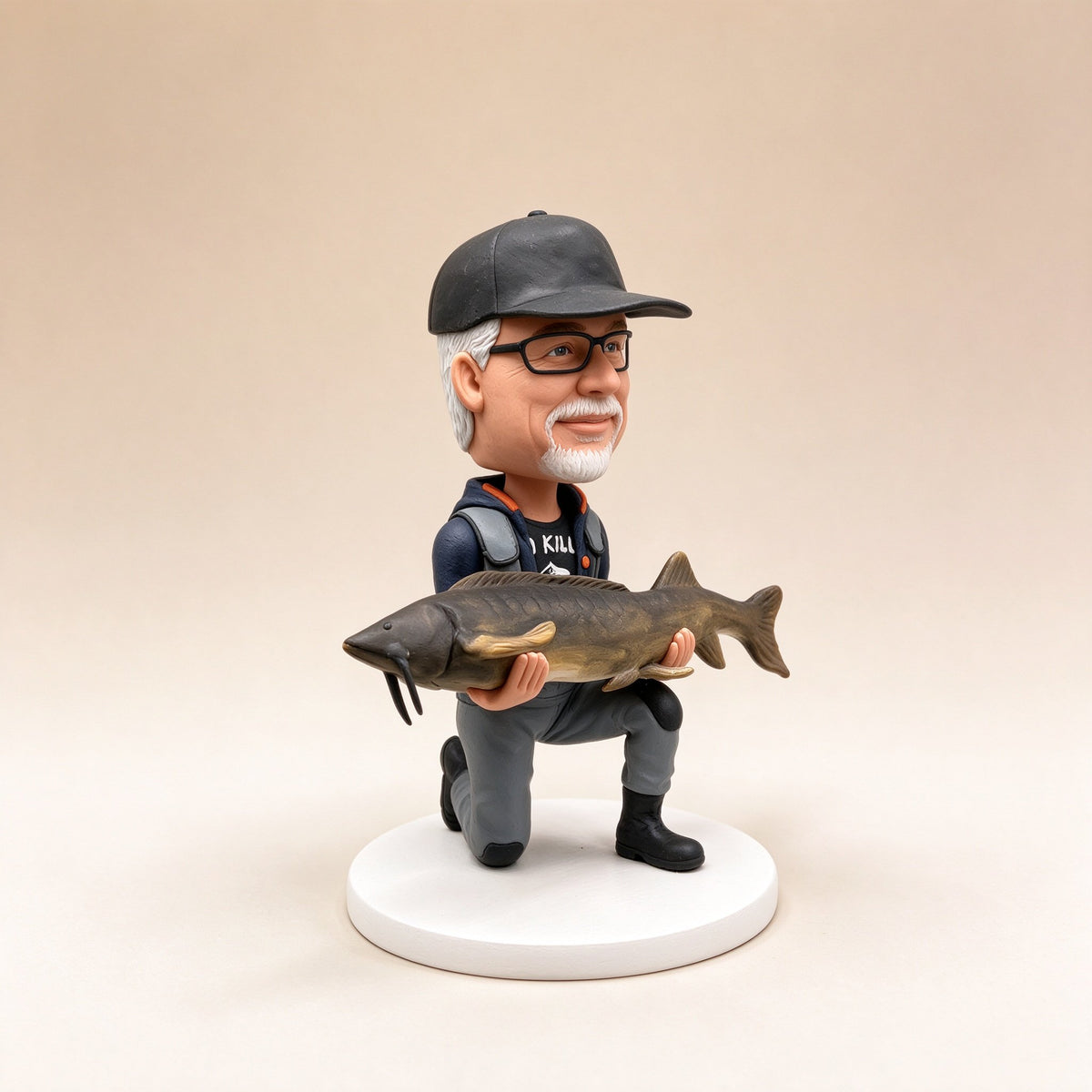 Side view of a custom fisherman figurine holding a fish