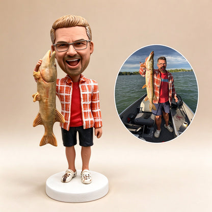Custom fisherman figurine holding a large pike, matched from a boat photo