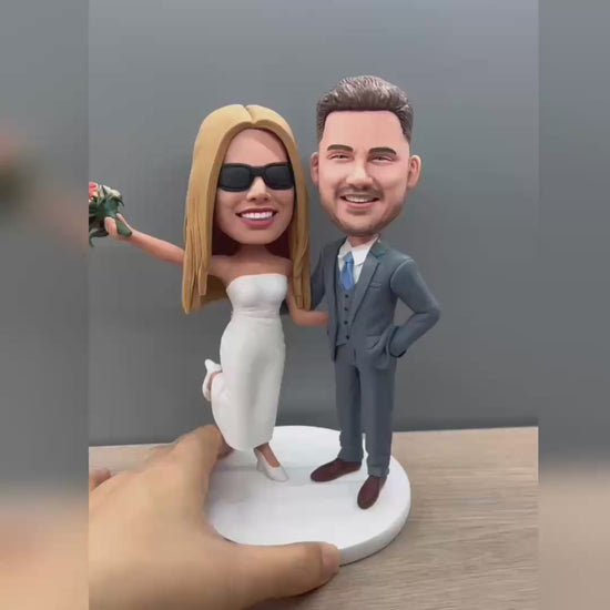 Custom wedding couple keepsake figurine made from a photo, turning in hand - handmade polymer clay